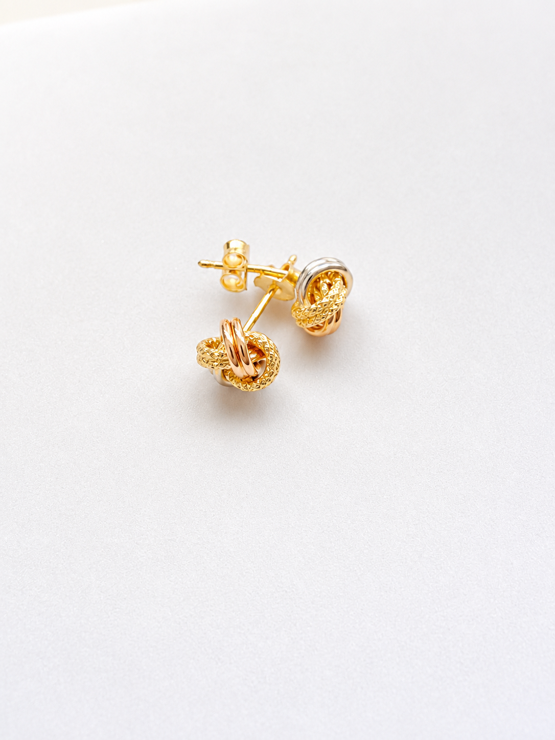 18K solid gold tri-tone knot stud earrings